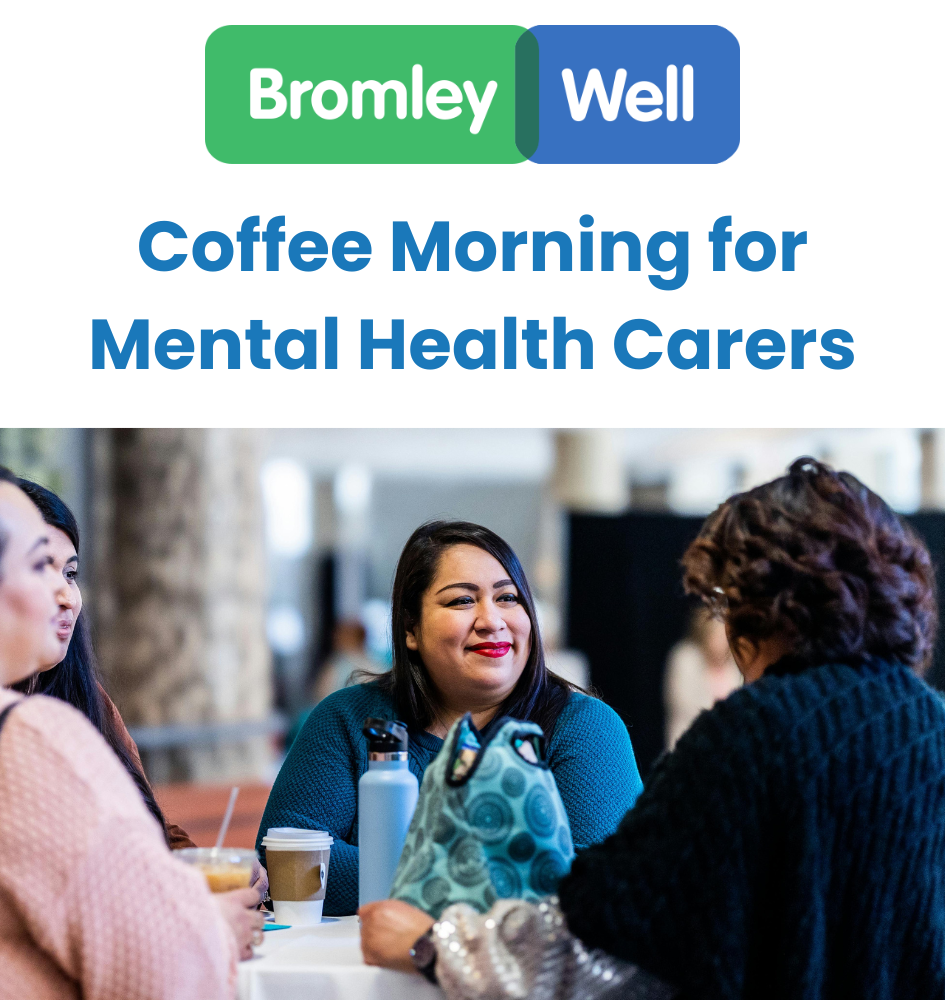 3 people round table drinking coffee. one woman faces us and is smiling