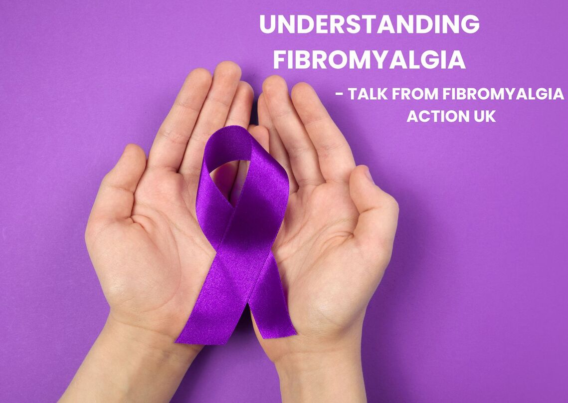 Hands holidng purple ribbon with writing saying understanding Fibromyalgia