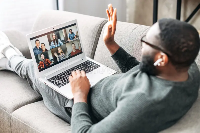 Man using laptop to attend an online support group