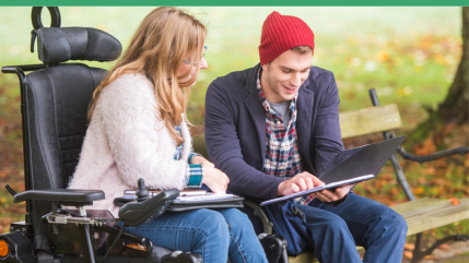 young man sat on park bench talking with a woman in a wheelchair.