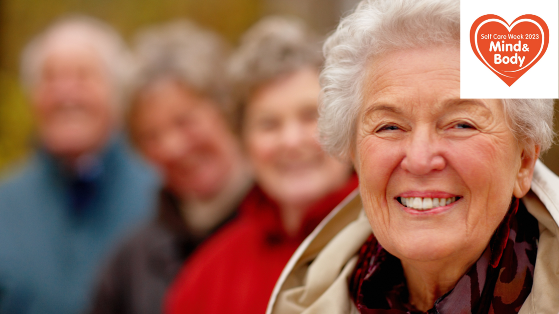 older women in focus with others in background with self care weeek logo top right