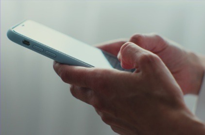 Hands holding a smartphone